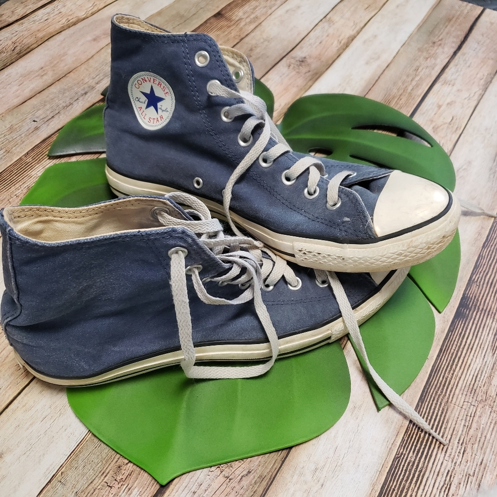 Blue converse high tops.